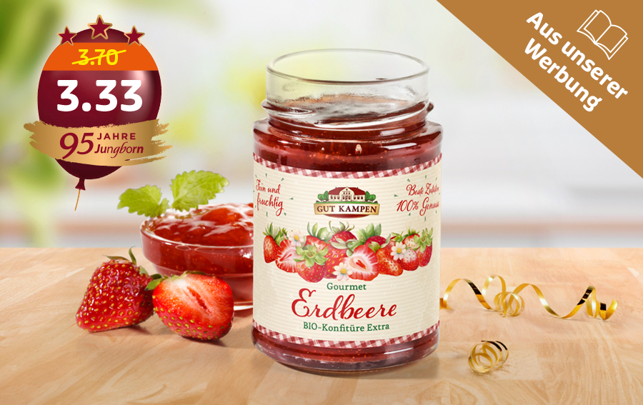 Erdbeer Bio-Konfitüre im Glas mit frischen Erdbeeren