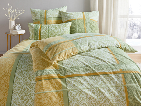 Grüne Bettwäsche mit Muster für ein gemütliches Winter-Schlafzimmer