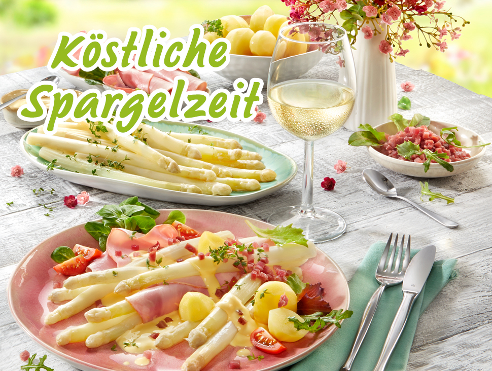 Frischer Spargel mit Schinken, Kartoffeln und Wein auf Frühlingstisch