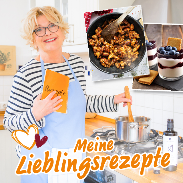 Saskia Vester mit Rezeptbuch und Fotos von Lieblingsgerichten in der Küche