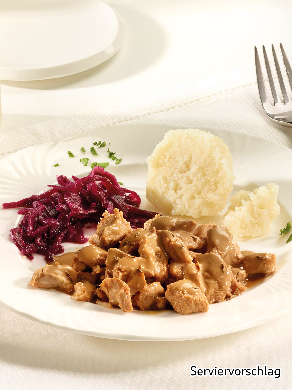 Schweinebratenstücke in Kümmelsauce