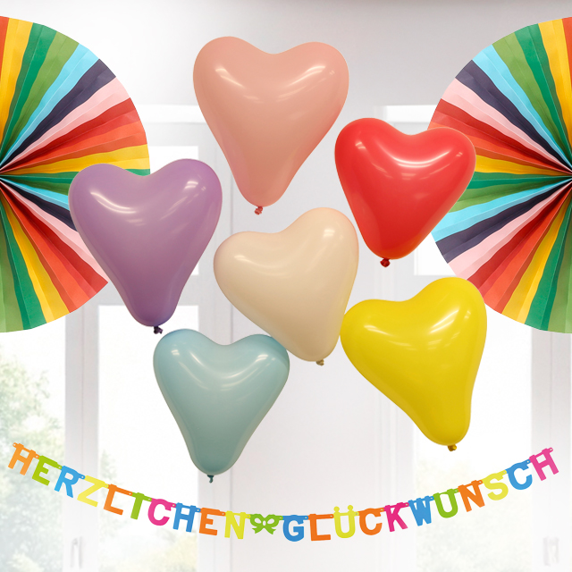 Bunte Geburtstagsdeko mit Herzballons und Girlande